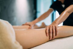 Masseur massaging masseuse during therapeutic tretment stock images Masseur massaging masseuse during therapeutic tretment stock images