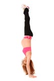 Maternity Hand Stand Upside Down. Beautiful fit young pregnant woman doing a hand stand upside down over white background Stock Photography Maternity Hand Stand Upside Down. Beautiful fit young pregnant woman doing a hand stand upside down over white background Stock Photography