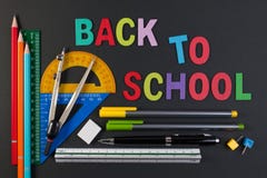 Mathematical Instruments Over The Corner Of Black Paper With Text Back To School. Mathematical Instruments Over The Corner Of Black Paper With Text Back To School.