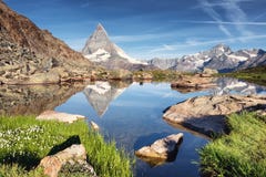 Matterhorn and reflection on the water surface at the morning time in Switzerland stock photos Matterhorn and reflection on the water surface at the morning time in Switzerland stock photos