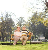 Mature couple relaxing in a park on beautiful day royalty free stock image Mature couple relaxing in a park on beautiful day royalty free stock image