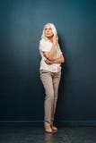 Mature old woman standing isolated stock photo Mature old woman standing isolated stock photo