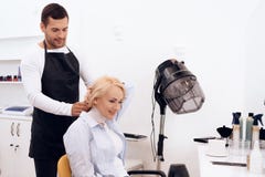Mature pretty woman is doing hairdo in beauty salon. Female stylish haircut. royalty free stock photo Mature pretty woman is doing hairdo in beauty salon. Female stylish haircut. royalty free stock photo