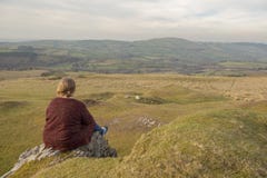 Mature woman sitting outdoors overlooking a view royalty free stock photo Mature woman sitting outdoors overlooking a view royalty free stock photo