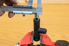 Measurement of tee diameter using calipers stock image Measurement of tee diameter using calipers stock image