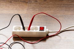 Measurement voltage in electrical socket with multimeter Royalty Free Stock Photo Measurement voltage in electrical socket with multimeter Royalty Free Stock Photo