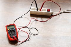 Measurement voltage in electrical socket with multimeter royalty free stock image Measurement voltage in electrical socket with multimeter royalty free stock image