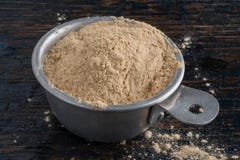 Measuring ground maca root powder royalty free stock photography Measuring ground maca root powder royalty free stock photography