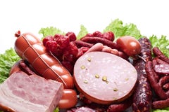 Meat And Sausages On Lettuce Leaves. Stock Images Meat And Sausages On Lettuce Leaves. Stock Images