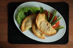 Cheburek fries with vegetables stock image Cheburek fries with vegetables stock image