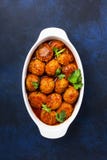 Meatballs With Tomato Sauce And Spices In Baking Dish On Blue Kitchen Table Background. Top View With Copy Space Royalty Free Stock Photo Meatballs With Tomato Sauce And Spices In Baking Dish On Blue Kitchen Table Background. Top View With Copy Space Royalty Free Stock Photo