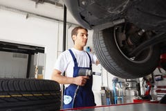 mechanic repairing tire