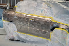 Car body work after the accident by preparing automobile for painting during repair royalty free stock image Car body work after the accident by preparing automobile for painting during repair royalty free stock image
