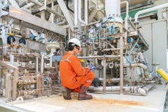 Mechanical engineer inspector inspection crude oil pump centrifugal type at offshore oil and gas central processing platform. stock photo Mechanical engineer inspector inspection crude oil pump centrifugal type at offshore oil and gas central processing platform. stock photo