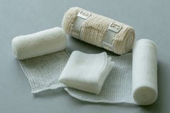 Medical bandages on gray background. stock photos Medical bandages on gray background. stock photos