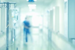 Medical drip in the blurred background of doctors stock images Medical drip in the blurred background of doctors stock images