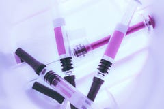 Medical Syringes inside a Sharps Collector stock photography Medical Syringes inside a Sharps Collector stock photography