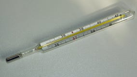 Medical thermometer to measure body temperature in hospital. Thermometer on white background stock photos Medical thermometer to measure body temperature in hospital. Thermometer on white background stock photos
