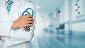 Medicine and healthcare concept. Doctor with stethoscope in clinic, close-up