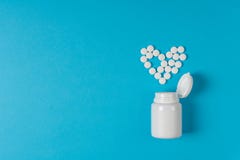 Medicine Pills Heart Shaped On Blue Background. Heart Protection. Drug Prescription For Treatment Medication. Pharmaceutical Medic Royalty Free Stock Photography