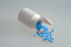Medicine Pills With A White Bottle Royalty Free Stock Image