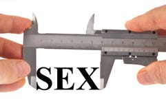Medida en sexo con un calibrador a vernier foto de archivo Medida en sexo con un calibrador a vernier foto de archivo