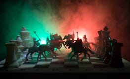 Medieval Battle Scene With Cavalry And Infantry On Chessboard. Chess Board Game Concept Of Business Ideas And Competition And Stra Stock Photo