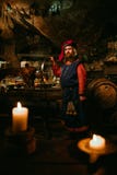 Medieval man doing roasted pig on the rack stock images Medieval man doing roasted pig on the rack stock images