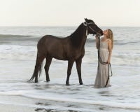Medieval Woman And Horse In Water Stock Images