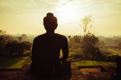 Meditierender Buddha morgens, Borobudur-Tempel lizenzfreies stockfoto Meditierender Buddha morgens, Borobudur-Tempel lizenzfreies stockfoto