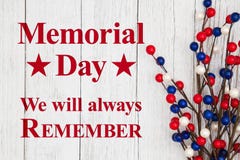 Memorial day text with red, white and blue berry spray. Memorial day we will always remember text with red, white and blue berry spray on weathered whitewash