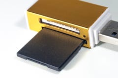 Memory gold card reader on white background royalty free stock images Memory gold card reader on white background royalty free stock images