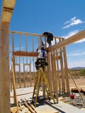 Men Building Frame For House - Vertical Royalty Free Stock Photography Men Building Frame For House - Vertical Royalty Free Stock Photography
