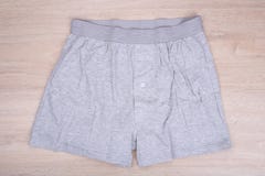 Men gray boxer shorts on wooden background Royalty Free Stock Photo Men gray boxer shorts on wooden background Royalty Free Stock Photo