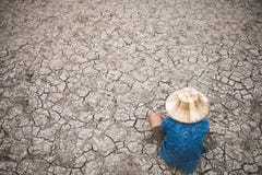 Men on ground cracked dry due to drought. royalty free stock photos Men on ground cracked dry due to drought. royalty free stock photos