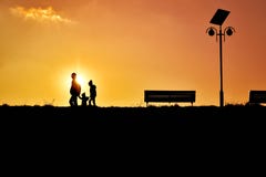Men Riding Silhouette People on Street Against Sky during Sunset Stock Images Men Riding Silhouette People on Street Against Sky during Sunset Stock Images
