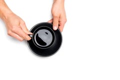 Men`s hands holding a black cup of coffee on white isolated background, place for text stock photos Men`s hands holding a black cup of coffee on white isolated background, place for text stock photos