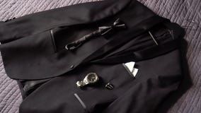 Men`s suit - black classic jacket, bow ties, cufflinks and watch