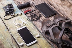 Men's travelling stuff mock up on wood background stock photo Men's travelling stuff mock up on wood background stock photo