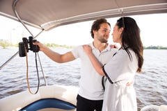 Men and women looking lovely at each other on yacht stock images Men and women looking lovely at each other on yacht stock images
