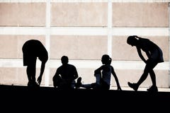 Men and women runners stretching. royalty free stock image Men and women runners stretching. royalty free stock image
