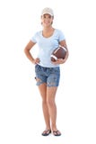 Menina desportiva com sorriso do futebol americano Imagens de Stock Royalty Free Menina desportiva com sorriso do futebol americano Imagens de Stock Royalty Free