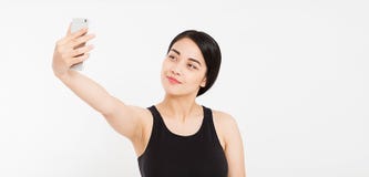 Menina feliz bonita para fazer o selfie isolado no branco fotografia de stock royalty free Menina feliz bonita para fazer o selfie isolado no branco fotografia de stock royalty free