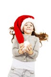 Menina no chapéu vermelho de Santa foto de stock royalty free Menina no chapéu vermelho de Santa foto de stock royalty free