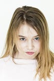 Menina sinistra com cabelo longo louro na roupa cor-de-rosa foto de stock royalty free Menina sinistra com cabelo longo louro na roupa cor-de-rosa foto de stock royalty free