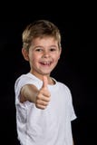 Menino extremamente satisfeito, feliz, alegre e sorrindo com um polegar direito acima fotos de stock Menino extremamente satisfeito, feliz, alegre e sorrindo com um polegar direito acima fotos de stock