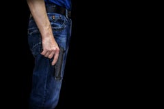 Mens met een kanon in zijn hand op een zwarte achtergrond stock afbeelding Mens met een kanon in zijn hand op een zwarte achtergrond stock afbeelding