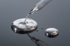 Mercury Pouring From A Pipette. Stock Photos Mercury Pouring From A Pipette. Stock Photos