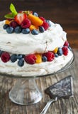 Meringue cake with fresh berries. Royalty Free Stock Photography Meringue cake with fresh berries. Royalty Free Stock Photography