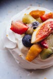 Meringue topping with fresh fruits including strawberry, mango, kiwi, blueberry and common fig served with sour fruit sauce Stock Image Meringue topping with fresh fruits including strawberry, mango, kiwi, blueberry and common fig served with sour fruit sauce Stock Image